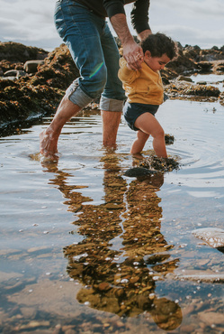 baby steps in pond with dad 