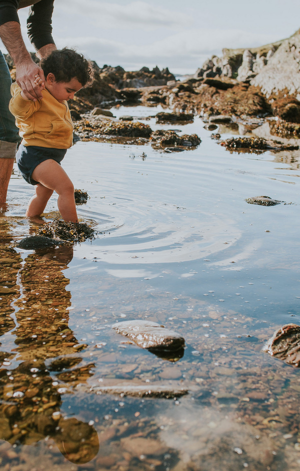 baby steps in pond with dad 