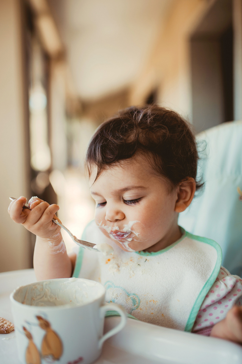 cute baby eating cereal 