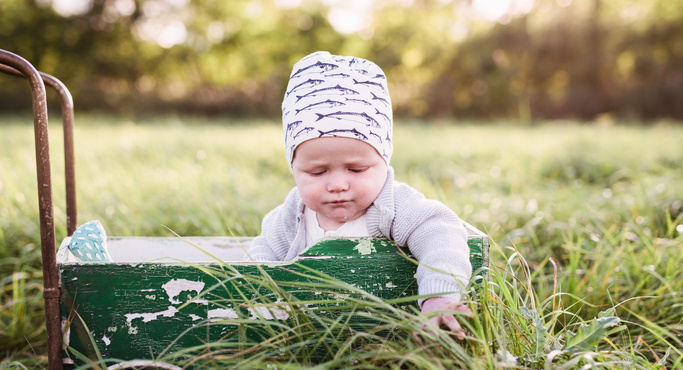 cute baby out on the farm