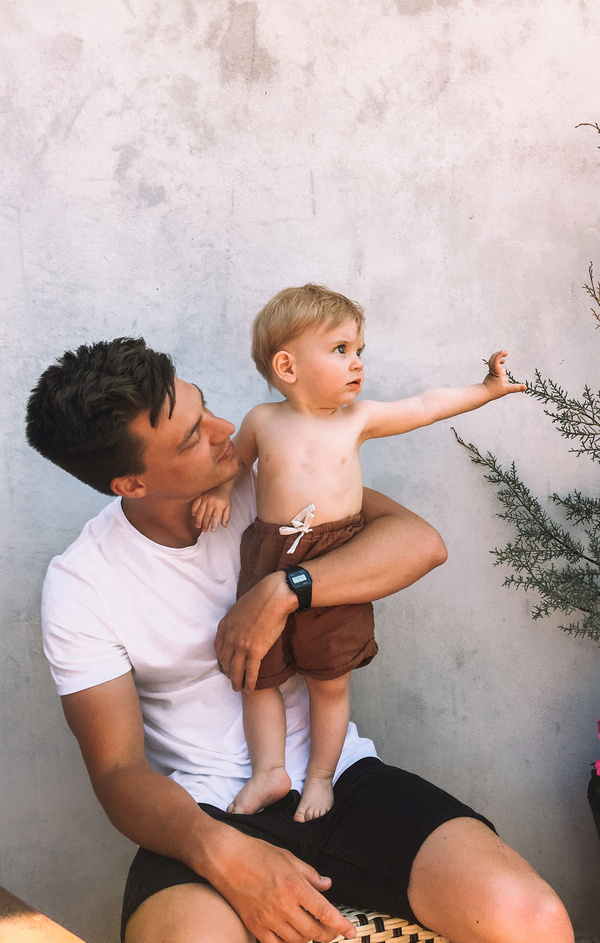 dad holding his kid on lap